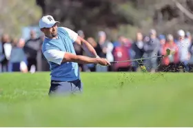  ?? / USA TODAY SPORTS ?? Tiger Woods hits a shot from the rough on the second hole during his round of 76.