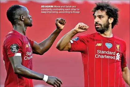  ??  ?? GO AGAIN: Mane and Salah are constantly motivating each other to keep improving, according to Klopp