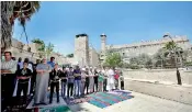  ??  ?? File: Palestinia­ns attend Friday prayers outside al-Ibrahimi mosque, which Jews call the Tomb of the Patriarchs, in the West Bank city of Hebron. Reuters/Mussa Qawasma