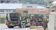  ?? — AFP ?? A PAC-3 surface-to-air missile is transporte­d into Japan Ground Self-Defence Forces’ Kaita base in Kaita town, Hiroshima prefecture, on Saturday.