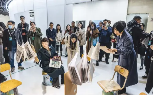  ?? Photo: Li Hao/GT ?? Visitors experience a book exhibition at The Song of the Earth: Artistic Documentar­y for a Better China exhibition at the China Millennium Monument’s Beijing World Art Museum on March 20, 2024.