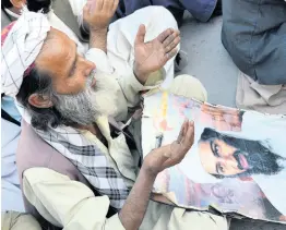  ?? AP PHOTOS ?? In this May 2, 2013 file photo, supporters of Pakistan’s religious party pray for the slain al-Qaida leader Osama bin Laden at a rally to pay tribute to him in Quetta, Pakistan.