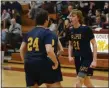  ?? OWEN MCCUE - MEDIANEWS GROUP ?? Pope John Paul II’s Justin Green (21) celebrates with teammate Dave Smrek (24) after Tuesday’s PIAA Class 4A win over Allentown Central Catholic.