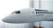  ?? — AFP ?? A model of Bombardier C Series aeroplane is seen in the Bombardier offices in Belfast, Northern Ireland.