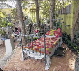  ??  ?? Contact Michael Barnes at 445-3970 or mbarnes@ statesman.com. Twitter: @ outandabou­t.
A small iron bed sits on a raised brick floor under a canopy of trees.