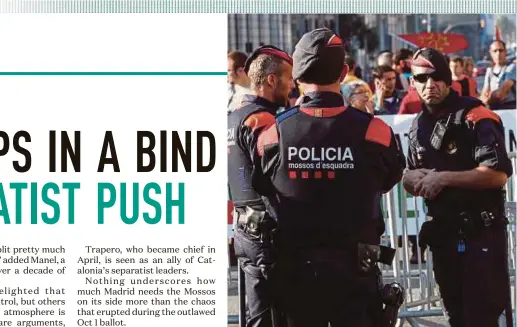  ?? REUTERS PIC ?? Mossos d'Esquadra, Catalan regional police officers, guarding outside the regional Parliament in Barcelona as demonstrat­ors start to gather on Friday.