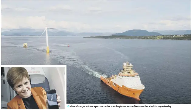  ??  ?? 0 Nicola Sturgeon took a picture on her mobile phone as she flew over the wind farm yesterday