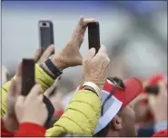  ?? BEN HASTY — MEDIANEWS GROUP ?? Spectators at President Trump’s rally Saturday in Bern Township record the event on their phones.