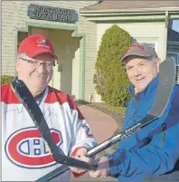  ?? MAUREEN COULTER/THE GUARDIAN ?? Montague councillor­s, from left, Wayne Spin and Jim Bagnall, face off outside of Town Hall earlier this week in anticipati­on of this weekend’s ball hockey tournament as part of the town’s 100 Days Festival. The festival kicked off Wednesday and will...