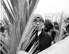  ?? AP ?? The faithful hold palm branches prior to the start of the Palm Sunday Mass in St Peter’s Square at the Vatican on Sunday, March 24.