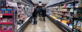  ?? AP PHOTO BY NAM Y. HUH ?? Customers shop at a grocery store in Mount Prospect, Ill., on April 1, 2022. Consumer prices surged 8.6% last month from 12 months earlier, faster than April’s year-over-year surge of 8.3%, the Labor Department said Friday, June 10, 2022.