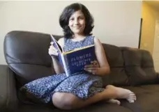  ?? BERNARD WEIL/TORONTO STAR ?? Gulmehek Khan, 12, hopes her book helps the victims of bullying.