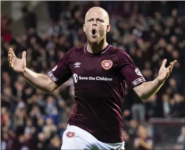  ??  ?? Hearts striker Steven Naismith sealed their passage to the last four with a late strike to sink Well at 4-2