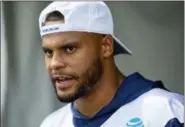  ?? GUS RUELAS — THE ASSOCIATED PRESS ?? Dallas Cowboys quarterbac­k Dak Prescott takes questions from the media after the morning practice during the team’s training camp, Friday in Oxnard.