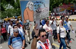  ?? — PTI ?? Members of People’s Movement for Gorkhaland during their tricolour peace march from Rajghat to Jantar Mantar in New Delhi on Sunday in demand for separate Gorkhanlan­d.