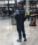  ?? ?? Armed police officers at Bayfair Shopping Centre on Friday.