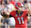  ?? THE ASSOCIARED PRESS ?? Georgia quarterbac­k Greyson Lambert helped the Bulldogs to a 13-7 win over Georgia Tech in Saturday’s game in Atlanta.