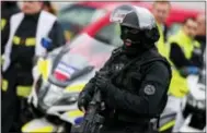  ?? THE ASSOCIATED PRESS ?? A member of the RAID (Research, Assistance, Interventi­on and Deterrence), France’s elite police force, patrols at Orly Airport, south of Paris, on Saturday.