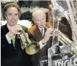  ??  ?? An ice-sculpted high-heel pump accompanie­d Bill Ingledew and Jim Pattison when the former celebrated his shoe store’s 100th anniversar­y.