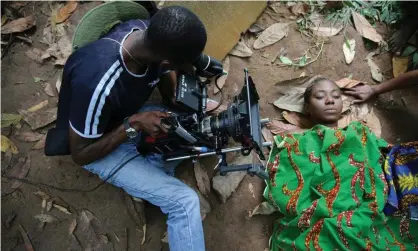  ?? Photograph: Akintunde Akinleye/Reuters ?? A scene being filmed for the movie October 1, a police thriller directed by Kunle Afolayan, in Ilaramokin village, southwest Nigeria.