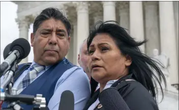  ?? ALEX BRANDON — THE ASSOCIATED PRESS ?? Beatriz Gonzalez, right, the mother of 23-year-old Nohemi Gonzalez, a student killed in the Paris terrorist attacks, and stepfather Jose Hernandez, speak outside the Supreme Court on Tuesday in Washington. A lawsuit against Youtube from the family of Nohemi Gonzalez was argued at the Supreme Court.