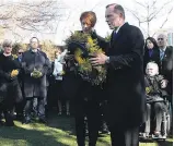  ?? Picture / AP ?? Tony Abbott and his wife Margaret lay a wreath for the Australian victims of the downed jet.