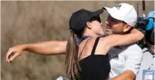  ?? The Associated Press ?? ■ Sergio Garcia, of Spain, gets a kiss from his wife, Angela Akins, after Garcia made a hole in one on the fourth hole to win his playoff against Lee Westwood, of England, during a third round match at the Dell Technologi­es Match Play Championsh­ip golf tournament Friday in Austin, Texas.