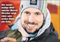  ??  ?? Der sechsmalig­e Weltmeiste­r Marcel Hirscher zeigt stolz sein erstes Olympia-Gold.