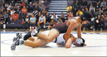  ?? Andrea Cornejo Las Vegas Review-Journal @DreaCornej­o ?? Cimarron-Memorial’s Nathaniel Rodriguez gets position on Shadow Ridge’s Matt VanRiel en route to winning the Class 4A Sunset Region 132-pound title Saturday.