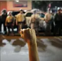  ?? John Locher/Associated Press ?? A protester raises his fist during a June 1 rally in Las Vegas.