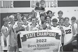  ?? LEX GOULD, ALEX GOULD/THE REPUBLIC ?? ALA Queen Creek players pose with their 4A state championsh­ip trophy and banner after defeating ALA Gilbert North.