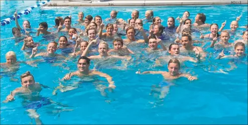  ?? David Fierro/Hearst Connecticu­t Media ?? Members of the Rocky Point Club swimming team celebrate in the pool at Roxbury Swim & Tennis Club after they won the team title at the Fairfield County Swim League Championsh­ips on Saturday in Stamford.