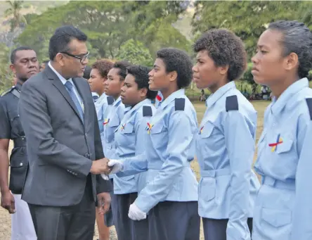  ?? Photo: Nacanieli Tuilevuka ?? Permanent Secretary for the Office of the Prime Minister and Sugar Industry Yogesh Karan with cadets during the passing-out parade at Nabala Secondary school in Naduri at Macuata Province on August 10, 2018.