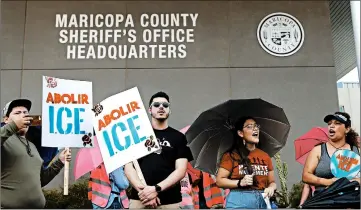  ?? ROSS D. FRANKLIN/AP ?? Immigratio­n activists protest against the Maricopa County Sheriff and Immigratio­n and Customs Enforcemen­t in Phoenix.