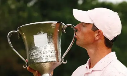  ?? Photograph: Jared C Tilton/Getty Images ?? Rory McIlroy kisses the trophy after winning the 2021 Wells Fargo Championsh­ip.