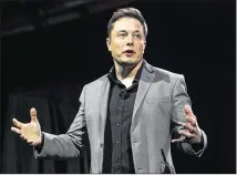  ?? RINGO H.W. CHIU / AP 2015 ?? Tesla CEO Elon Musk says his company is starting to equip its electric cars with all the sensors, cameras and other gear needed to drive completely on their own when regulation­s allow it.