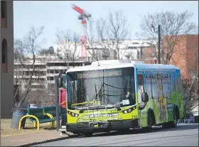  ?? (NWA Democrat-Gazette/Andy Shupe) ?? An Ozark Regional Transit bus waits Friday at a timed stop at Hillcrest Towers in downtown Fayettevil­le. Ozark Regional Transit plans to make some improvemen­ts to bus stops in 2023. Visit nwaonline.com/photo for today’s photo gallery.