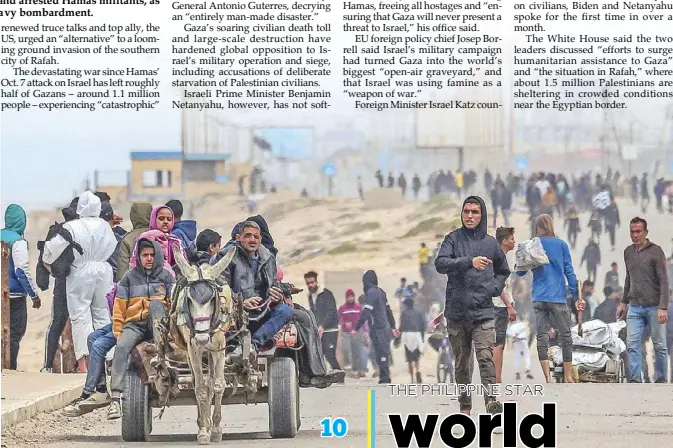  ?? AFP ?? Displaced Palestinia­ns fleeing from al-Shifa hospital arrive via the coastal highway at the Nuseirat refugee camp in central Gaza Strip on Monday.