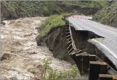  ?? NATIONAL PARK SERVICE PHOTOS VIA AP ?? High water in the Gardiner River along the North Entrance to Yellowston­e National Park in Montana washed out part of a road on Monday.