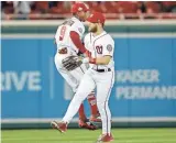  ?? PABLO MARTINEZ MONSIVAIS/AP ?? Washington’s Rafael Bautista (9) and Bryce Harper (34) celebrate on the field at the end of a baseball game against Pittsburgh at Nationals Park.