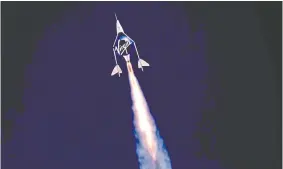  ?? VIRGIN GALACTIC VIA REUTERS ?? With rocket ignition, Virgin Galactic's passenger rocket plane VSS Unity carrying Richard Branson and crew begins its ascent to the edge of space
Sunday above Spaceport America near Truth or Consequenc­es, N.M.