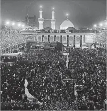  ?? HADI MIZBAN THE ASSOCIATED PRESS ?? Shiite Muslim worshipper­s gather in front of the holy shrine of Imam Hussein to mark the Muslim festival of Arbaeen in Karbala.