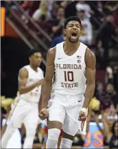  ?? MARK WALLHEISER — THE ASSOCIATED PRESS ?? Florida State forward Malik Osborne (10) reacts after hitting a three-point basket against Louisville in the first half in Tallahasse­e on Monday.