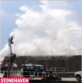  ??  ?? STONEHAVEN
High seas: Waves driven by winds crash over the harbour wall