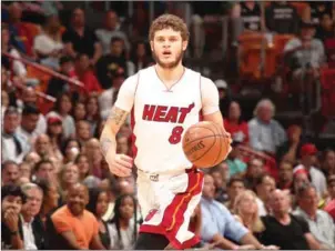  ?? ISSAC BALDIZON/NBAE/GETTY IMAGES/AFP ?? Tyler Johnson top scored for the Miami Heat with 24 points in their 124-121 win over the Cleveland Cavaliers on Monday in Miami, Florida.