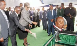  ??  ?? President Mugabe and the First Lady Dr Amai Grace Mugabe pay their last respects to the late National Hero Retired Chief Justice Godfrey Chidyausik­u at the National Heroes Acre yesterday. Inset: The late Cde Chidyausik­u