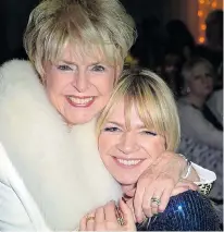  ??  ?? Star sound... Gloria hugs new breakfast host Zoe Ball