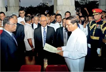  ??  ?? January 9, 2015: The Opposition's common candidate, Maithripal­a Sirisena, taking oaths as Sri Lanka's Executive President after his election victory. He promised he would usher in good governance