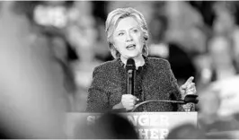  ?? CHARLIE NEIBERGALL/ASSOCIATED PRESS ?? Hillary Clinton speaks during a rally at Theodore Roosevelt High School on Friday in Des Moines, Iowa. Afterward, she called on the FBI to release more informatio­n.