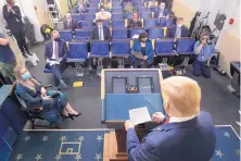  ?? ALEX BRANDON/ASSOCIATED PRESS ?? President Donald Trump arrives to speak with reporters about the coronaviru­s in the James Brady Press Briefing Room of the White House Friday in Washington.